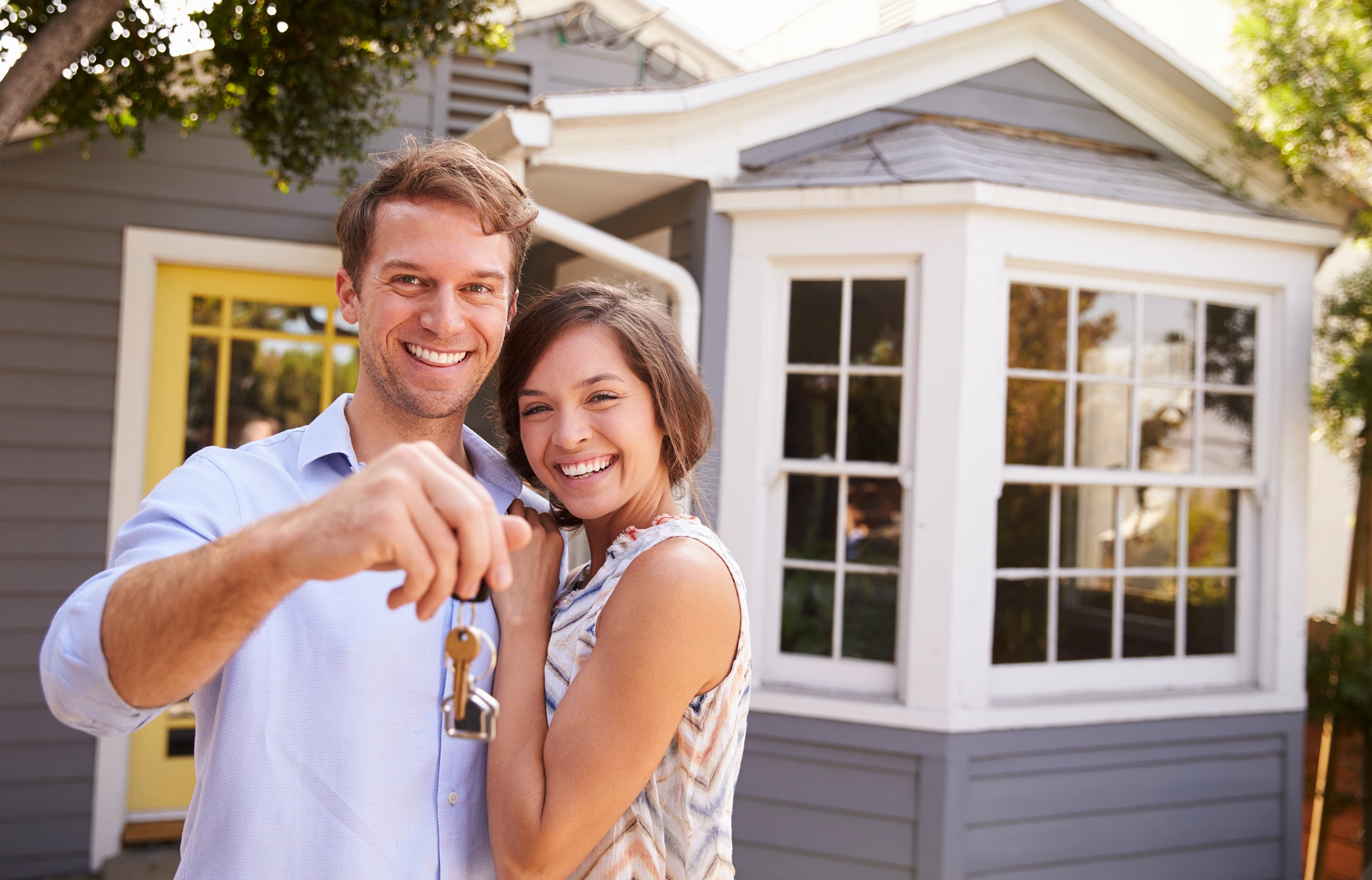 Couple Holding Keys to Home