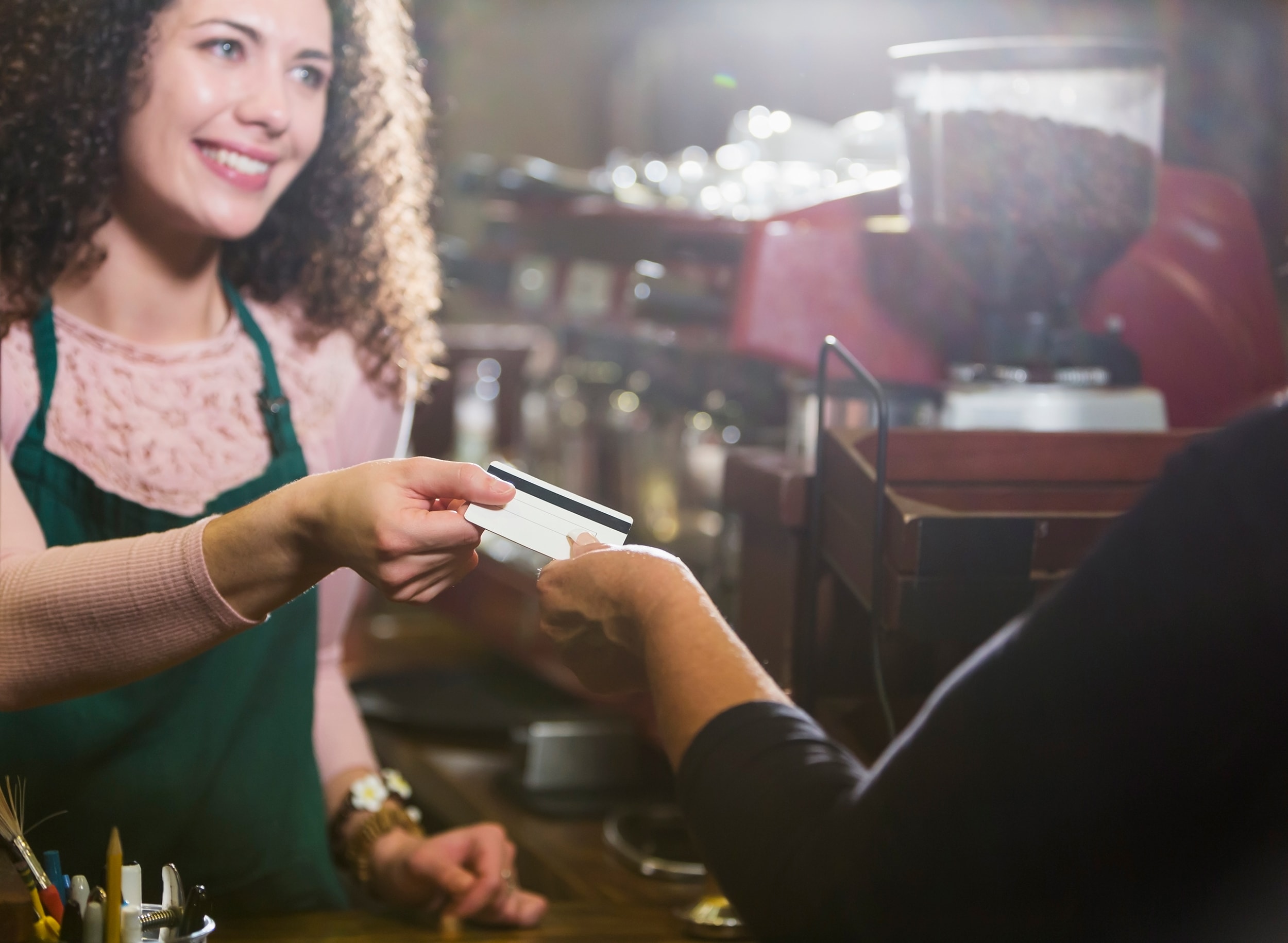 Woman Receiving Credit Card for Purchase